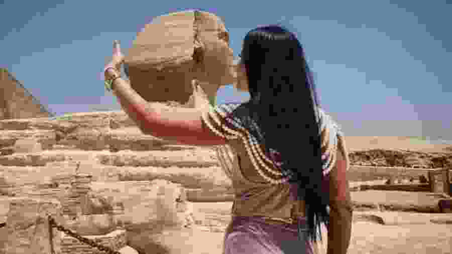 Travelers next to the Great Sphinx of Giza