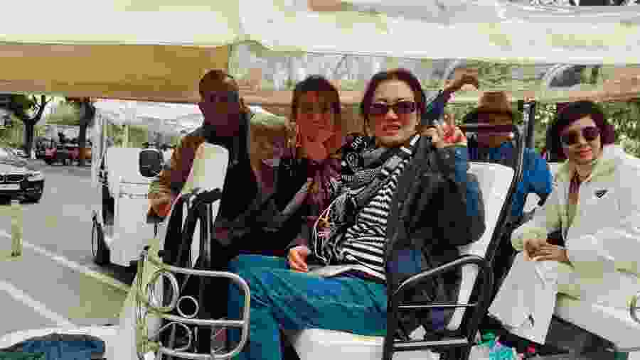 Travellers at Lisbon with an electric Tuk Tuk