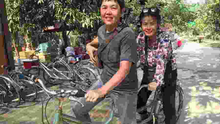 Happy guests riding bicycles