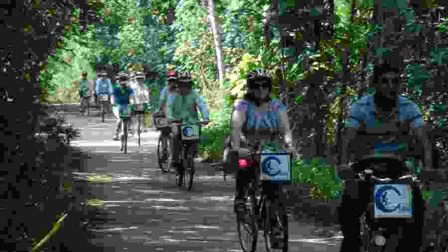 Tourists cycling near the local village.