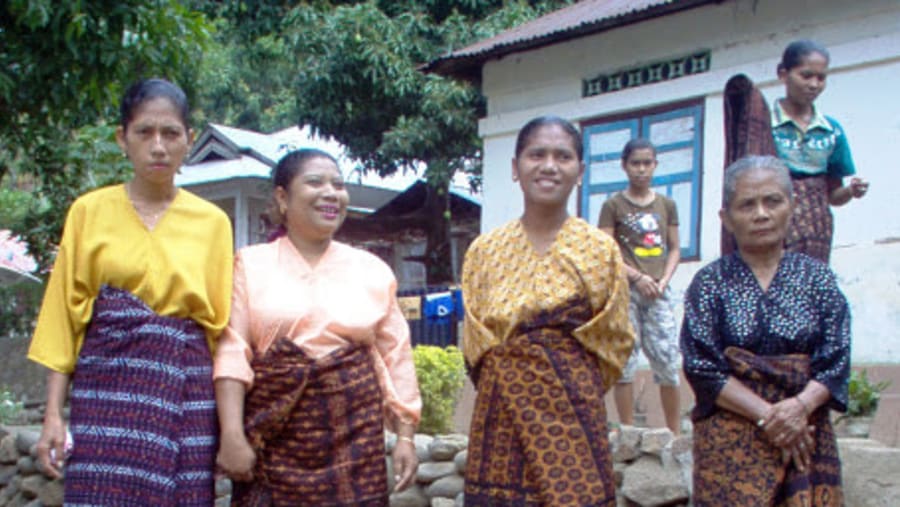 Weavers in traditional dress
