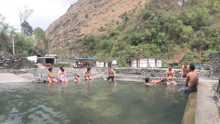 Pilgrims taking a dip in the Tatopani Kund