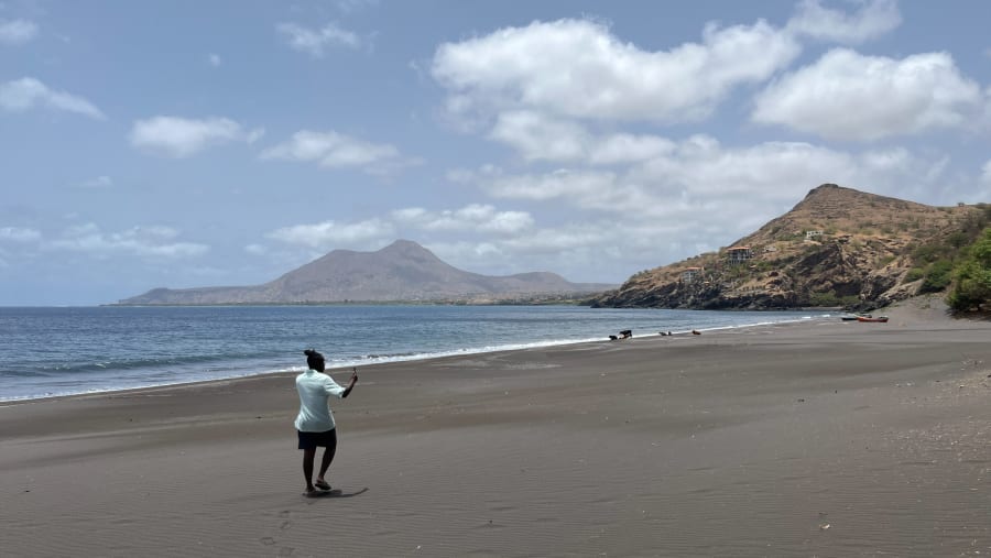 Marvel at Black sand beach
