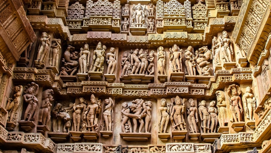Close up of artful carved walls of Kandariya Mahadeva Temple, Khajuraho Group of Monuments, India