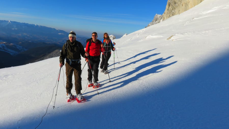 Travellers snowshoeing In Romania