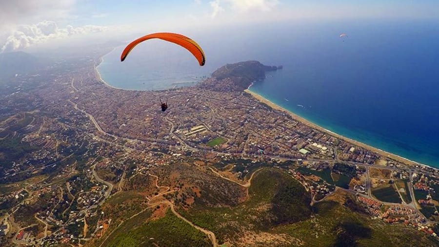 Travellers paragliding in Tandem