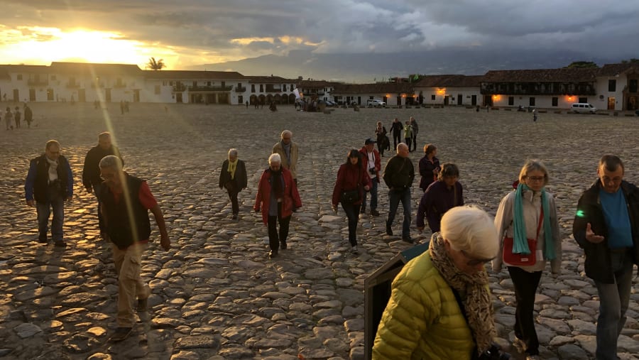 Travelers enjoying a sunset city tour.