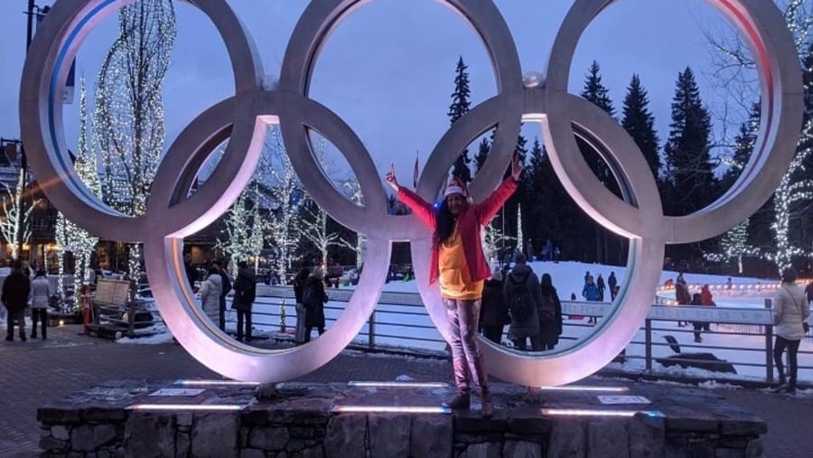 Traveller next to the Whistler Olympic Rings Alamy
