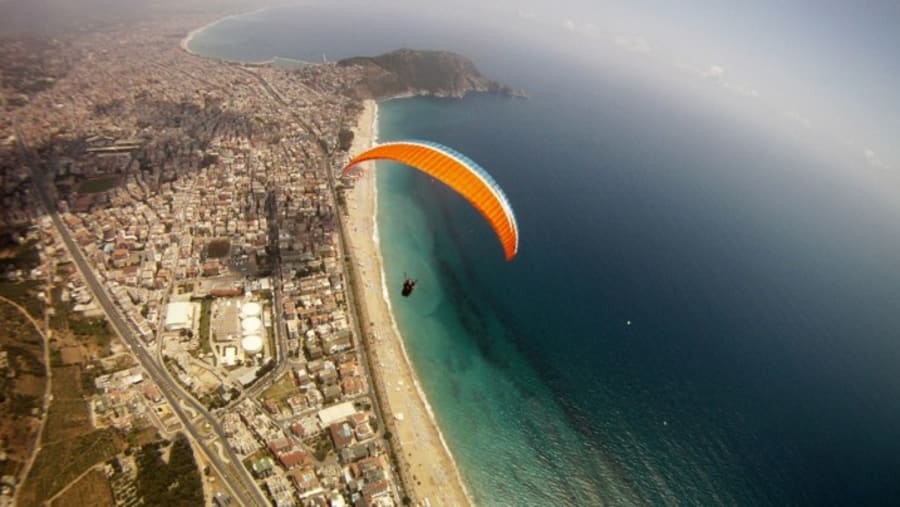 Travellers paragliding in Tandem