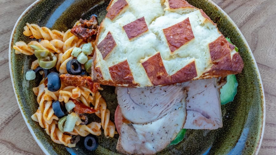 A vibrant spread of pasta, meats, and salads from the Geysir Glíma Restaurant