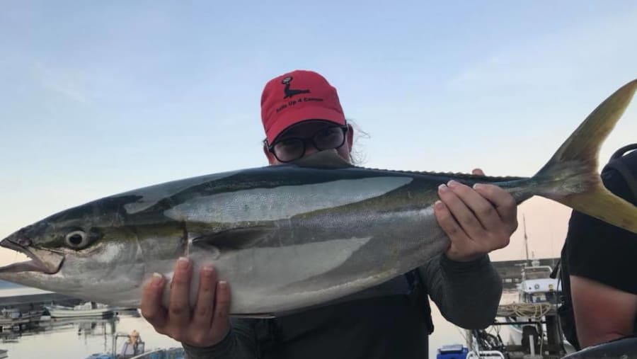 Tourist with the Freshly-Caught Fish
