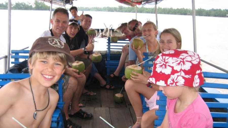 Tourists Having Coconut Water on the Boat