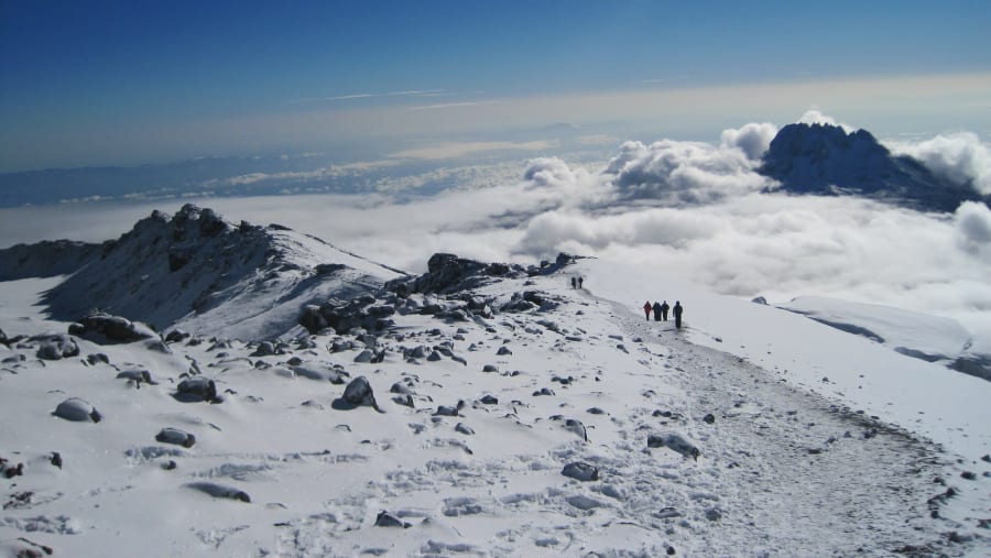 Witness stunning landscapes from Mount Kilimanjaro's highest peak, Uhuru Peak