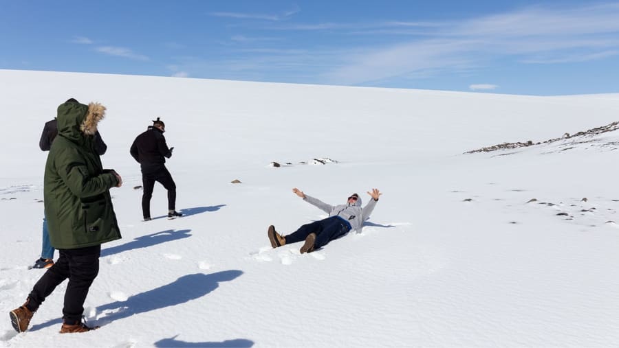 People having fun on the snow on Langjökull Glacier