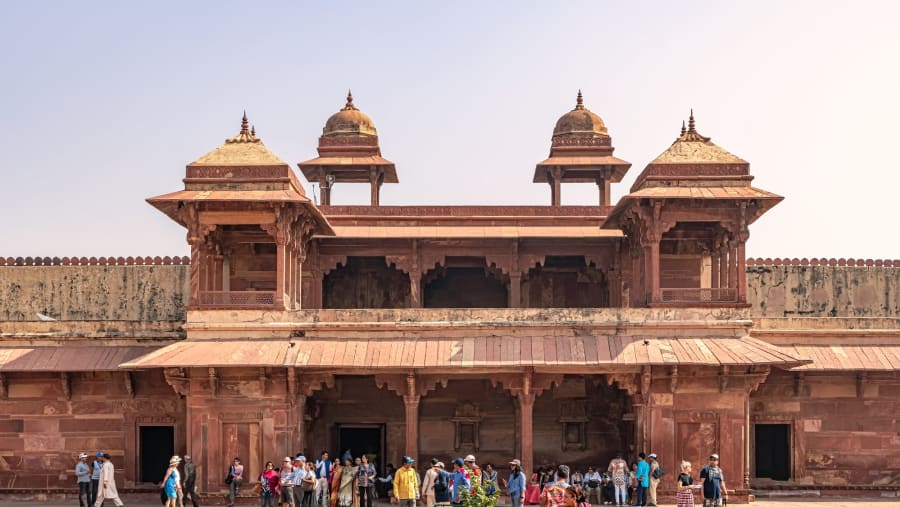 Tourists visiting Panch Mahal, Royal Palace in Fatehpur Sikri, City built by Great Mughal Emperor Akbar at late 16th century.
