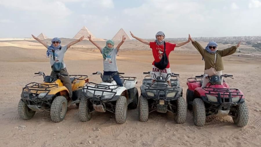 Tourists on ATV Quad Bikes at Giza Pyramid