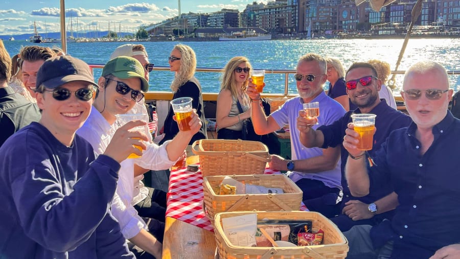 Travellers enjoying Food and Drinks at the Oslofjord Cruise