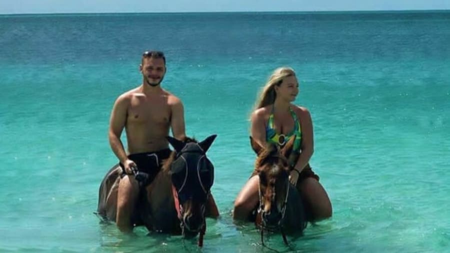 Couple enjoying horse riding