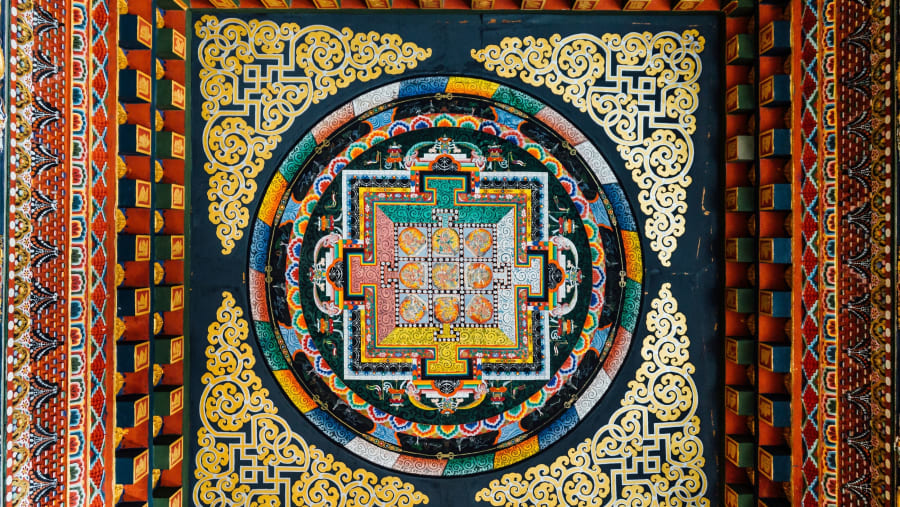 Decorated ceiling that tell about Lord Buddha story in Bhutanese art inside The Royal Bhutanese Monastery in Bodh Gaya