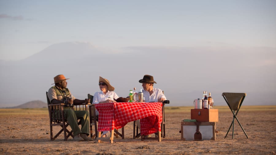 Happy tourists with the guide in Amboseli National Park