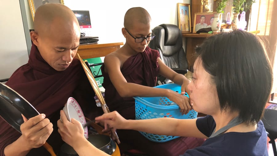 Offering alms to monks