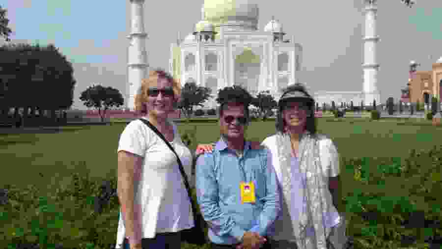 Tourists Posing Infront Of Taj Mahal