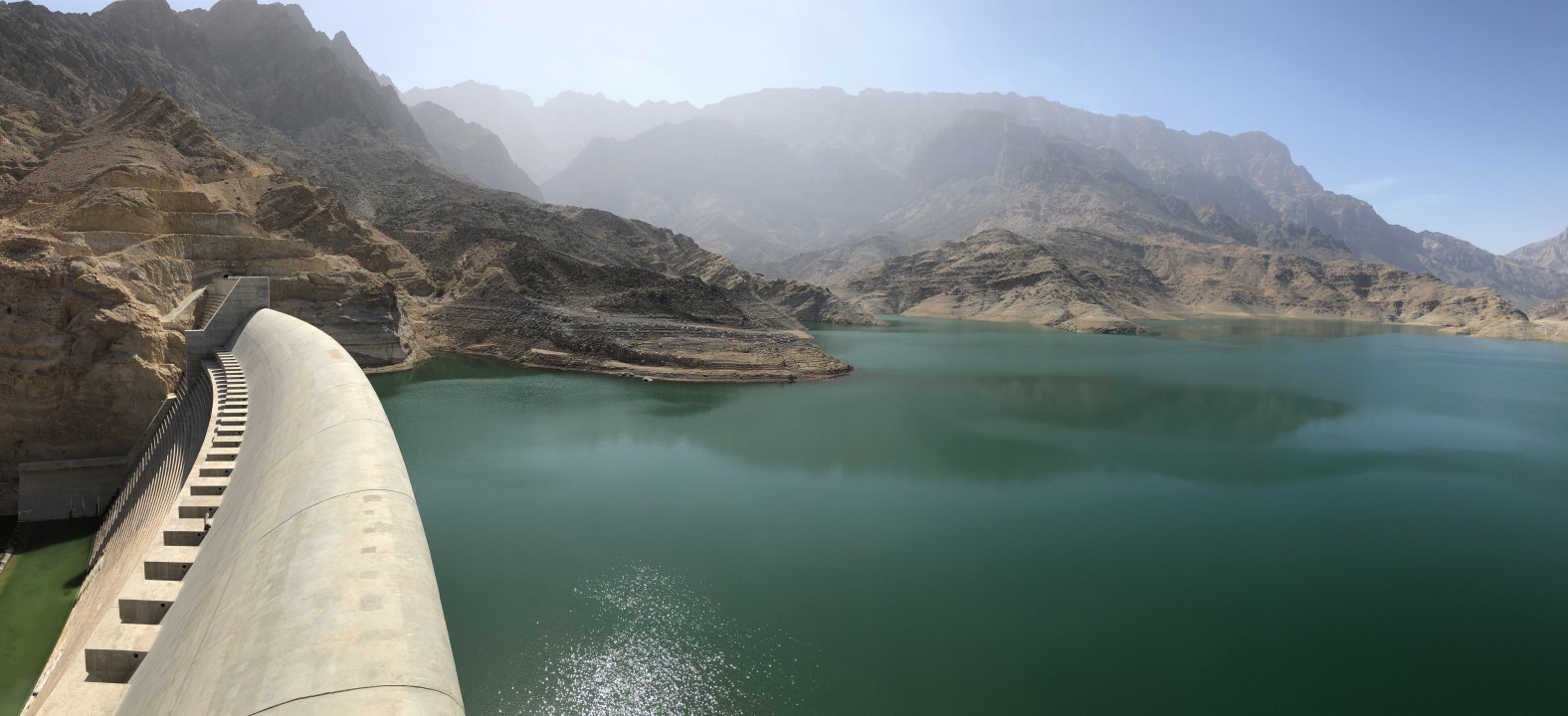 oasis valley of Wadi Shab, reservoir of clear turquoise water, Bimmah Sinkhole
