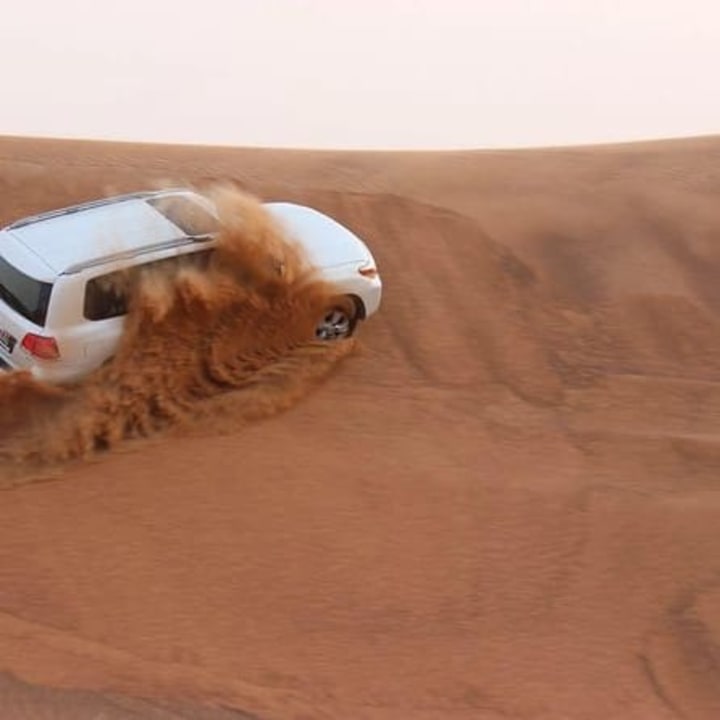 red dunes outside Dubai, golden sandy desert, Desert Camp Experience