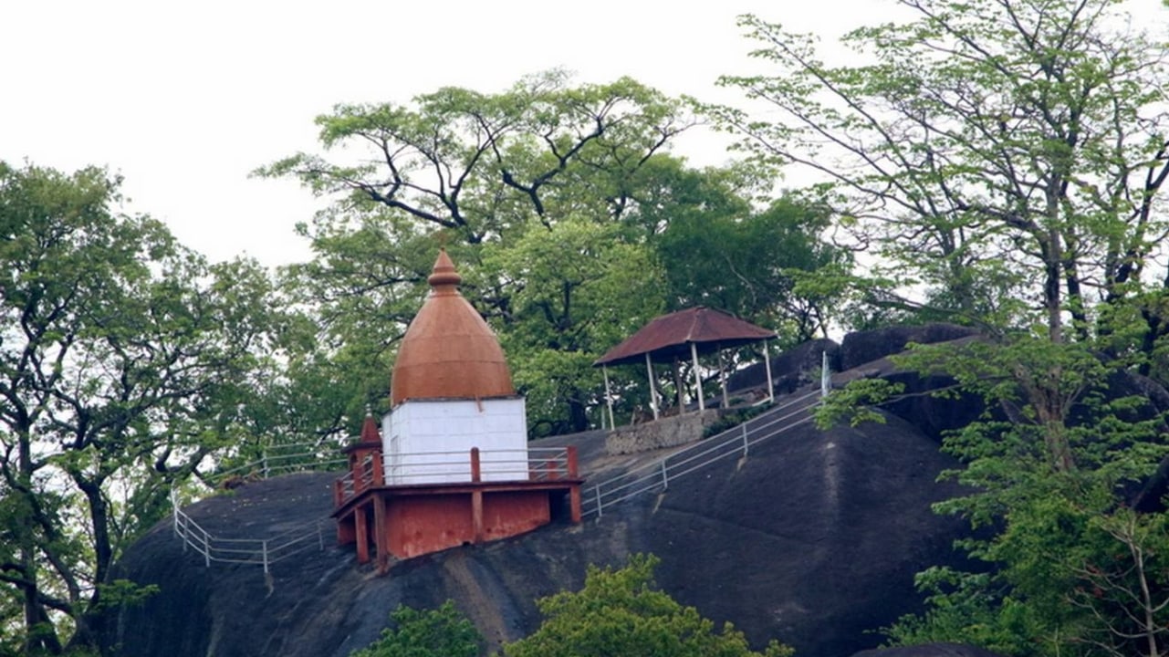 Sri Surya Pahar rock outcrops, Nandeswar Devalaya hilltop temple, Hulukanda Hill panoramic Brahmaputra Valley views, Dudhnoi Reserve Forest birdlife