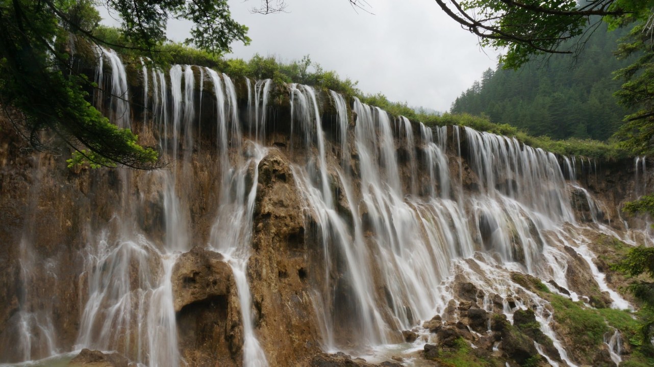 Menghai morning market, stilt houses of a Bulang village, 400-year-old pagoda, jungle waterfall