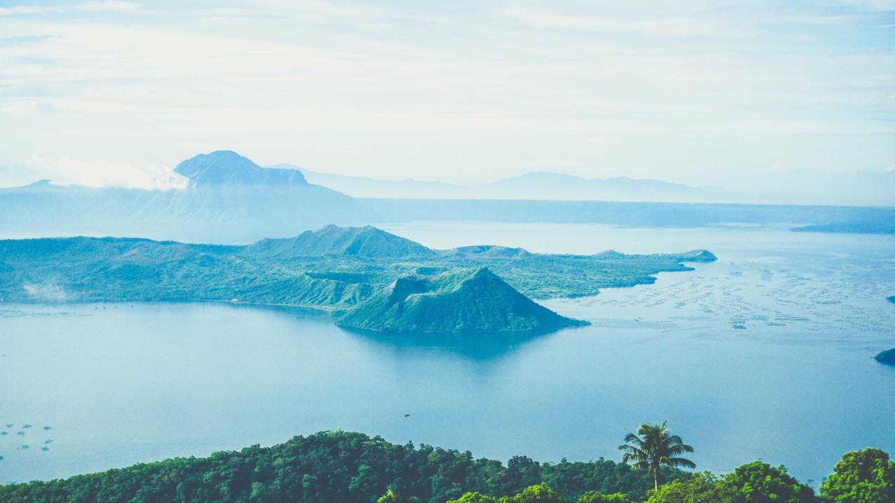 Tagaytay hilltop views, the lake of an active volcano, rocky area surrounding Taal Volcano, boat and horse ride