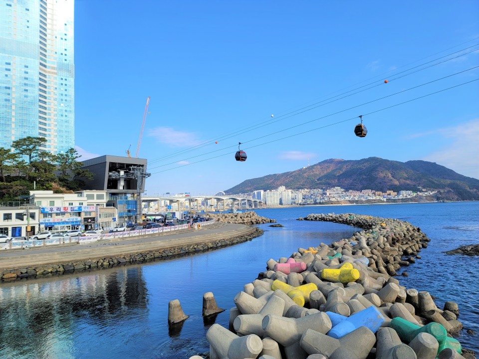 Gamcheon Culture Village's brightly painted houses, Songdo Beach skywalk, Jagalchi Market stalls