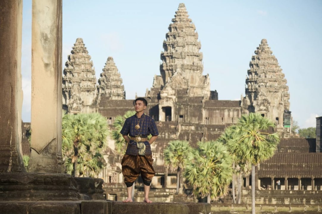 Angkor Wat, Bayon Temple's serene stone faces, Ta Prohm Temple's tree-clad ruins