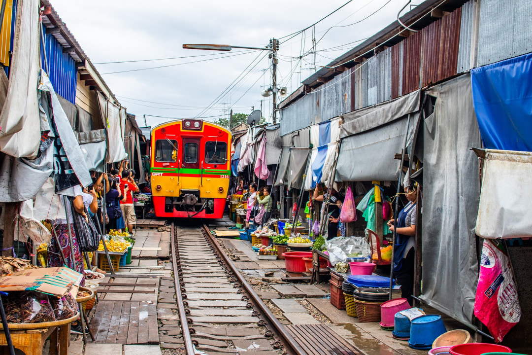 Damnoen Saduak Floating Market canals, baby elephants and elephant ride, Maeklong Railway Market stalls