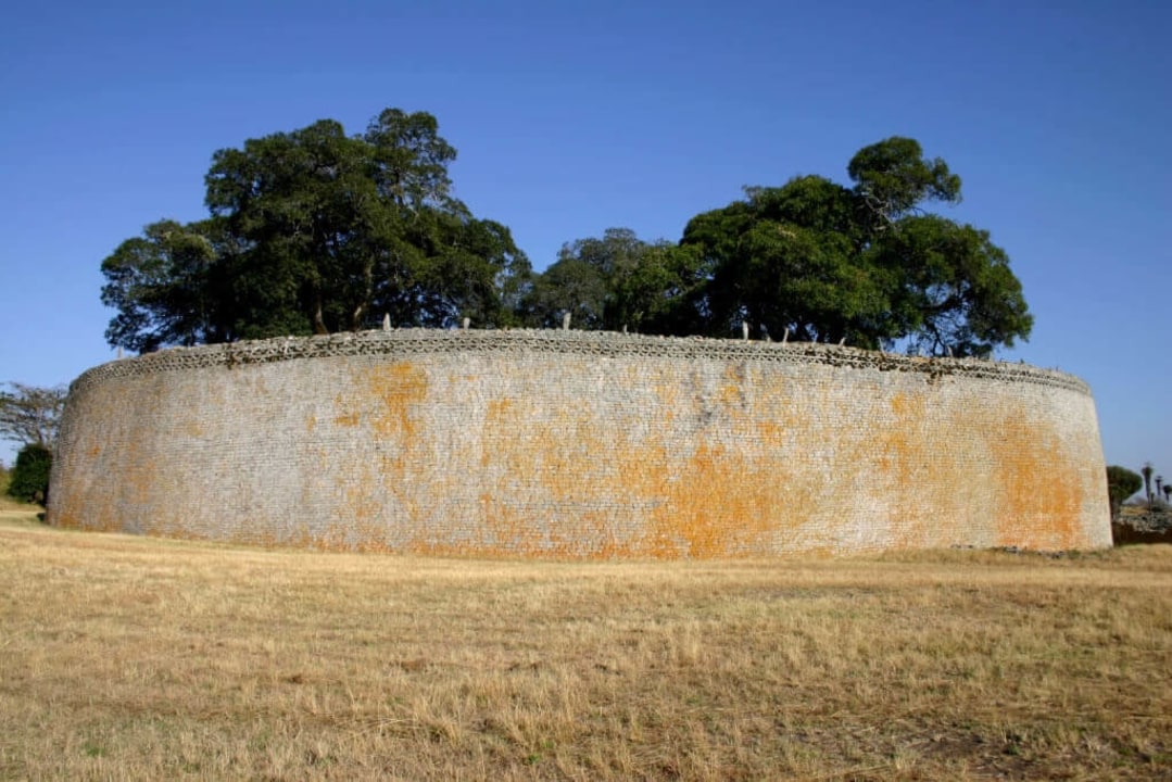 Great Zimbabwe monuments, Matobo Hills National Park rock art, Hwange National Park wildlife, Victoria Falls and Zambezi River sunset
