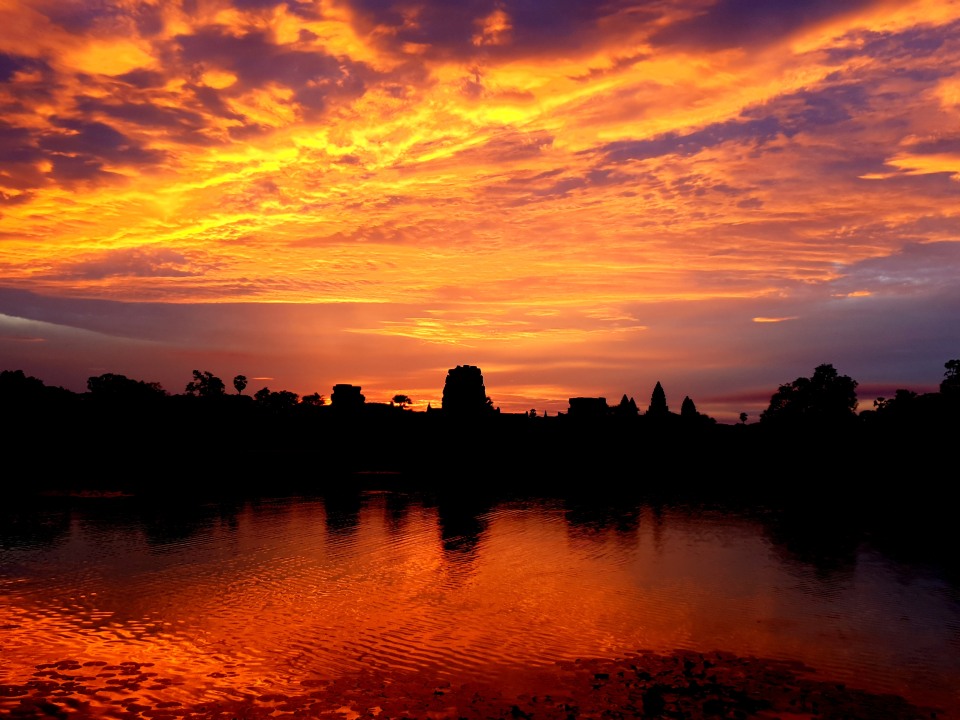 Angkor Wat at sunrise, Ta Prohm jungle ruins, Bayon face towers