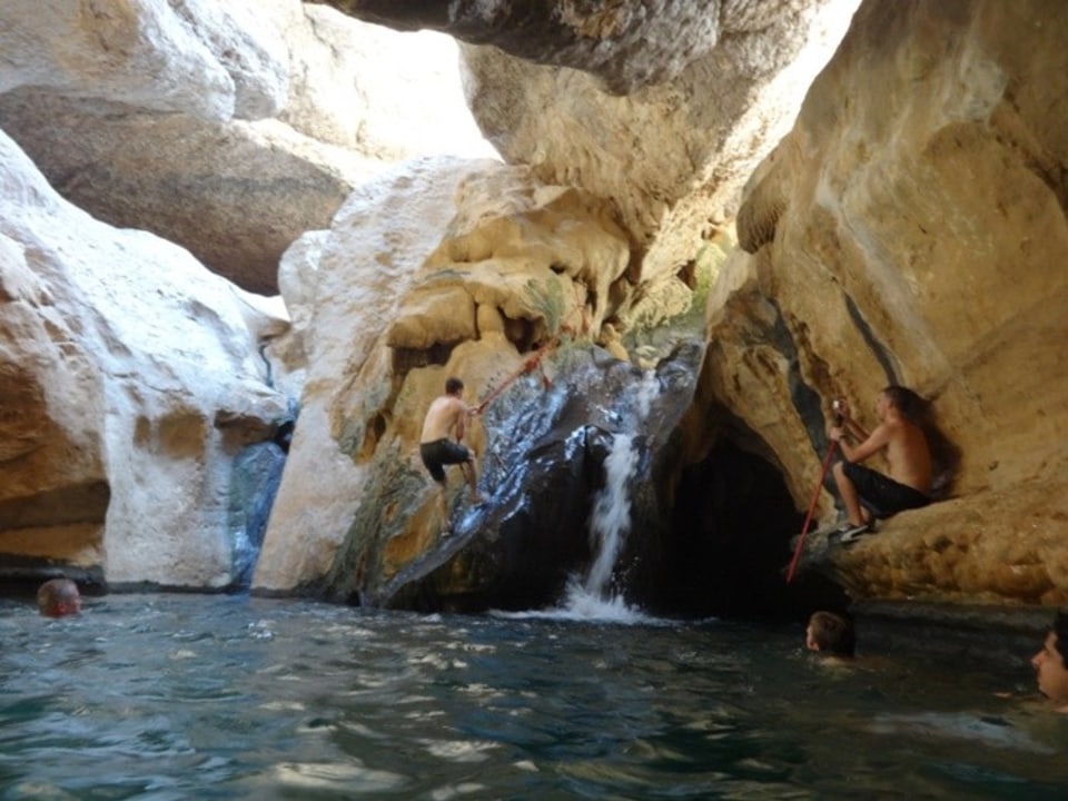 Wadi Ash Shab canyon, famous pools of Wadi Shab, cave with a waterfall, Muscat coast
