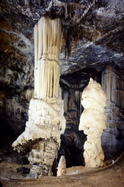 Postojna Cave, Predjama Castle on a 123 m high cliff, mountainous drive from Ljubljana