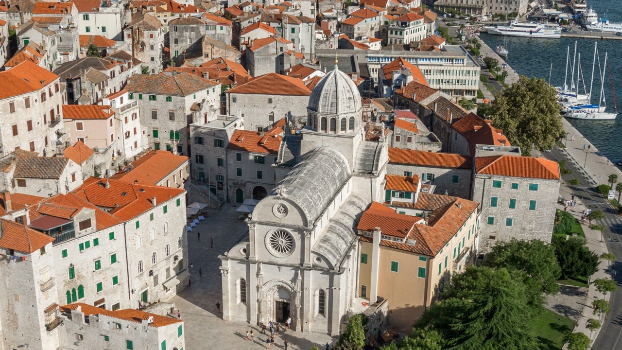 Krka National Park waterfalls, scenic wooden pathways, Šibenik Cathedral, Dalmatian coastline