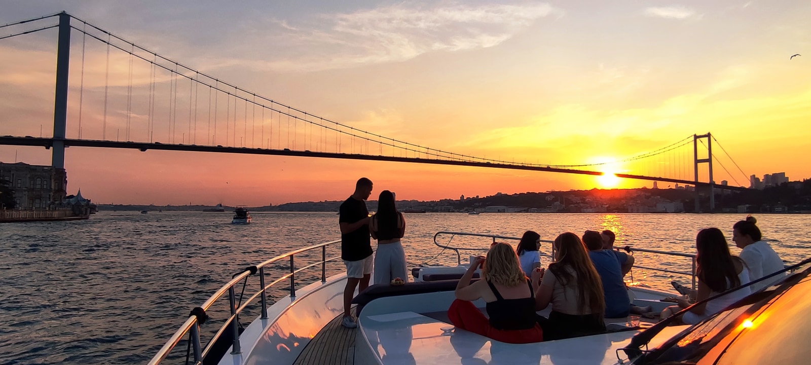 Bosphorus Strait at sunset, Ortaköy Mosque on the shoreline, Rumelian Fortress on the Bosphorus, Maiden's Tower offshore