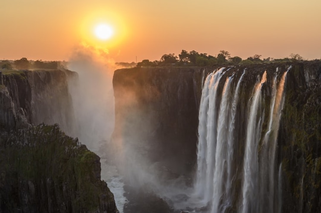 Victoria Falls rainforest and gorge, Chobe River sunset cruise, Elephant Sands waterhole, Okavango Delta Mokoro rides