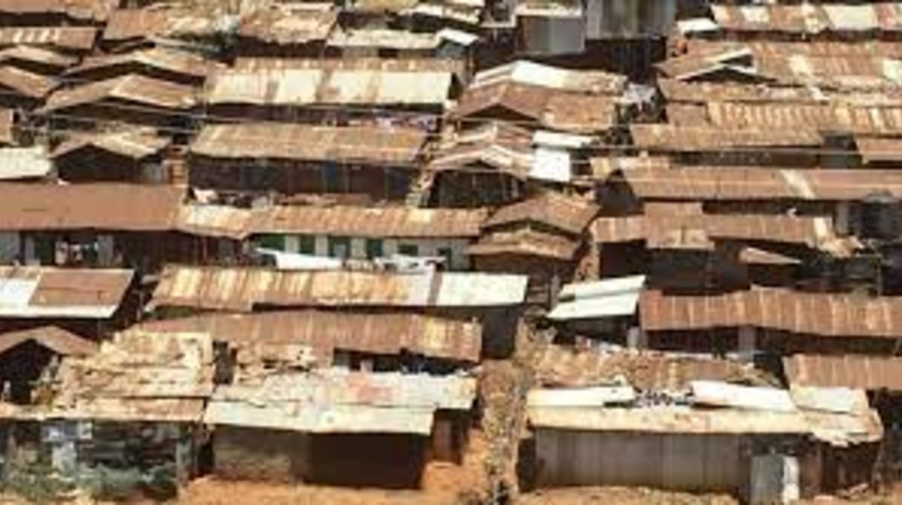 Kibera Slum, Prestige Plaza on Ngong Road, colonial-built railway lines, the many football pitches