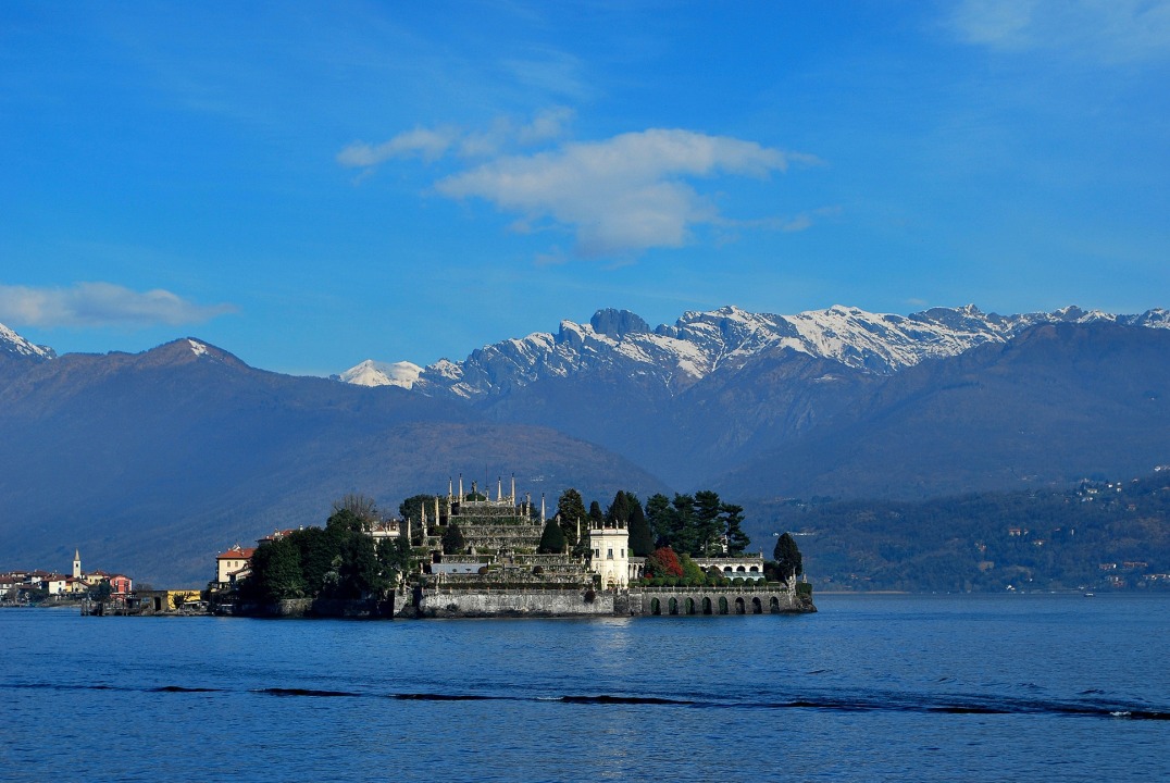Isola Bella Baroque palace, luxuriant Italian-style gardens, Church of San Vittore spire