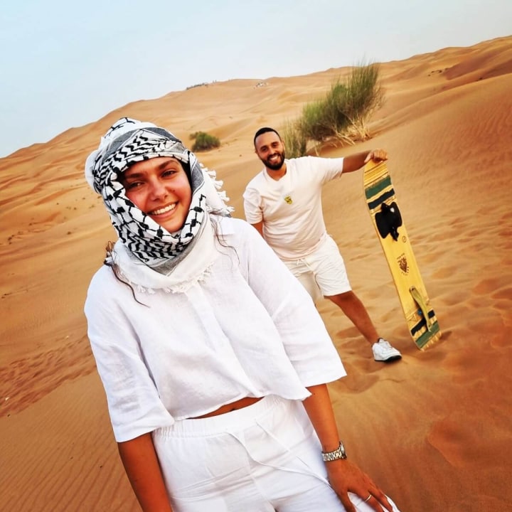 Al Madam Desert, high red dunes, Camel ride, Sandboarding