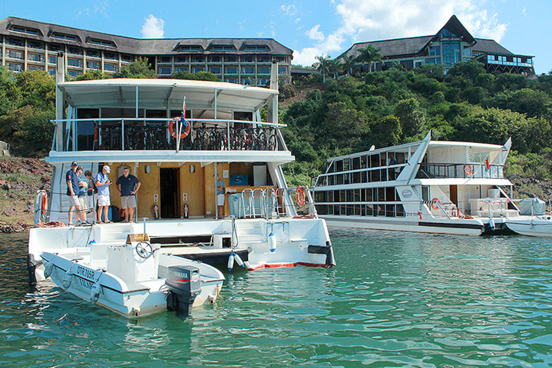 Hluhluwe-Imfolozi Park game drive, the crystal clear waters of Kosi Bay Mouth, Jozini Lake views