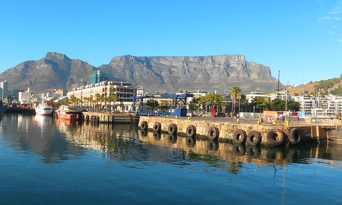 Table Mountain skyline, Robben Island ferry, Bo-Kaap coloured houses, V&A Waterfront promenade