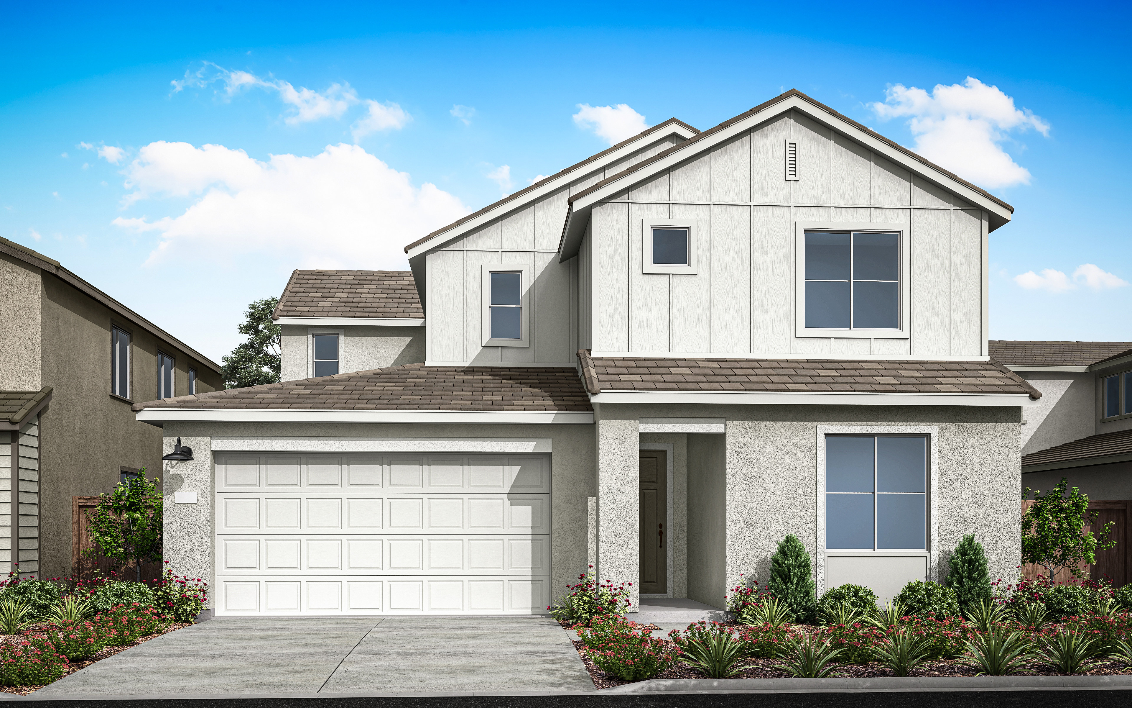 A two-story white house with a garage door, surrounded by landscaped gardens and a clear blue sky with fluffy clouds.