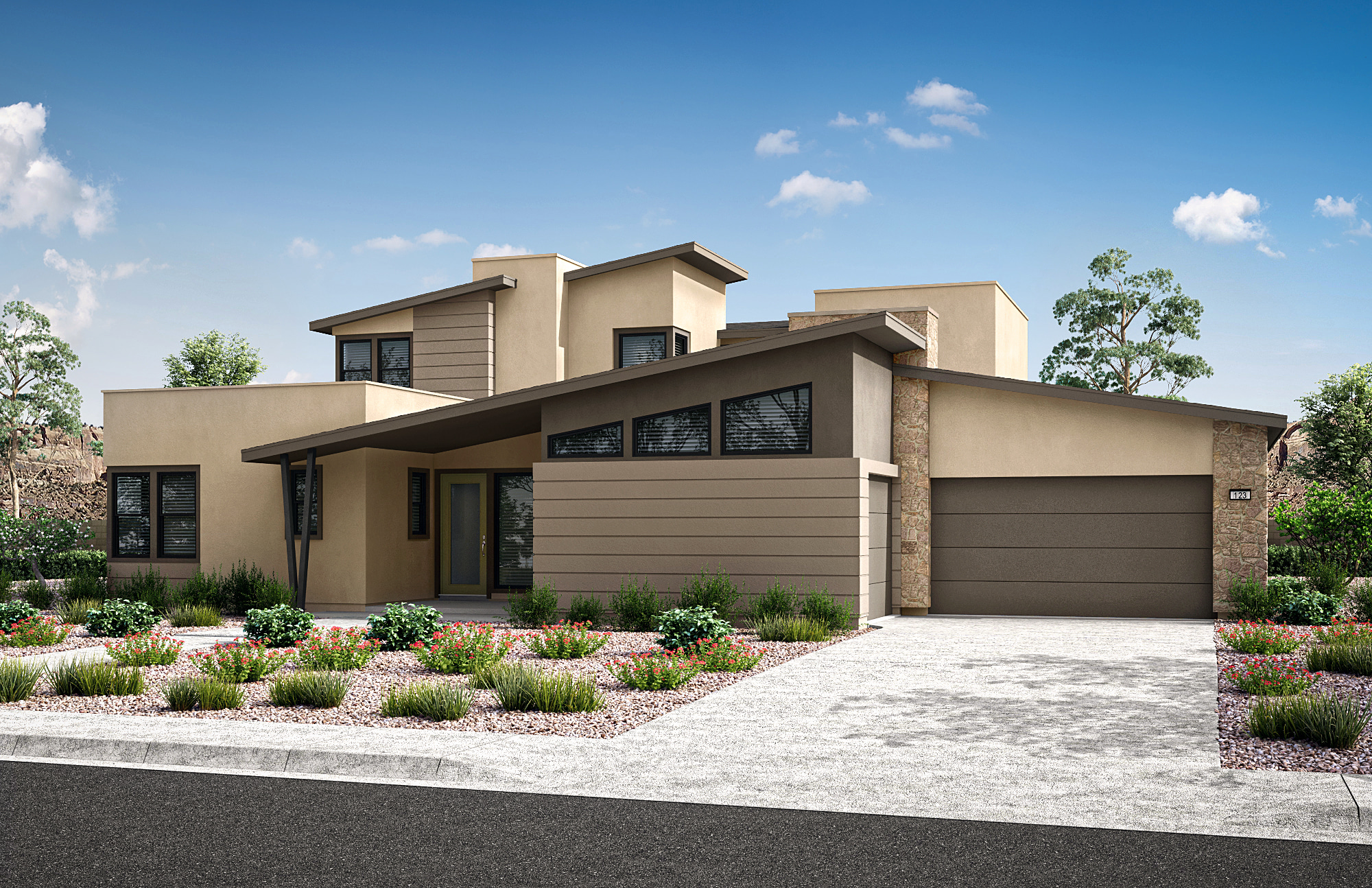 A modern, two-story house with a beige exterior, a garage, and a well-landscaped front yard with a paved driveway and flowering plants against a clear blue sky with fluffy white clouds.