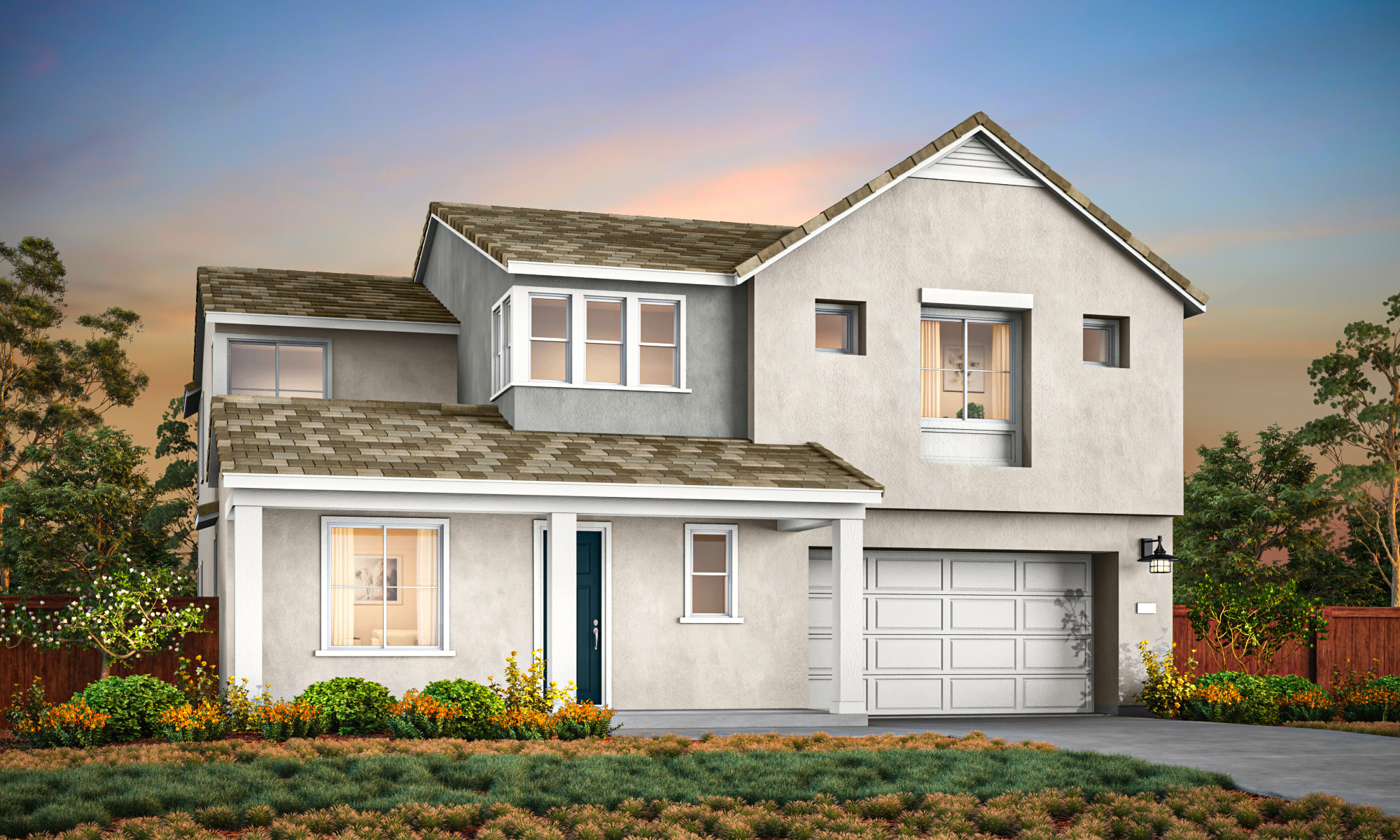 A two-story residential house with a garage, surrounded by a well-maintained garden and landscaping, set against a backdrop of a clear sky with a warm, colorful sunset.