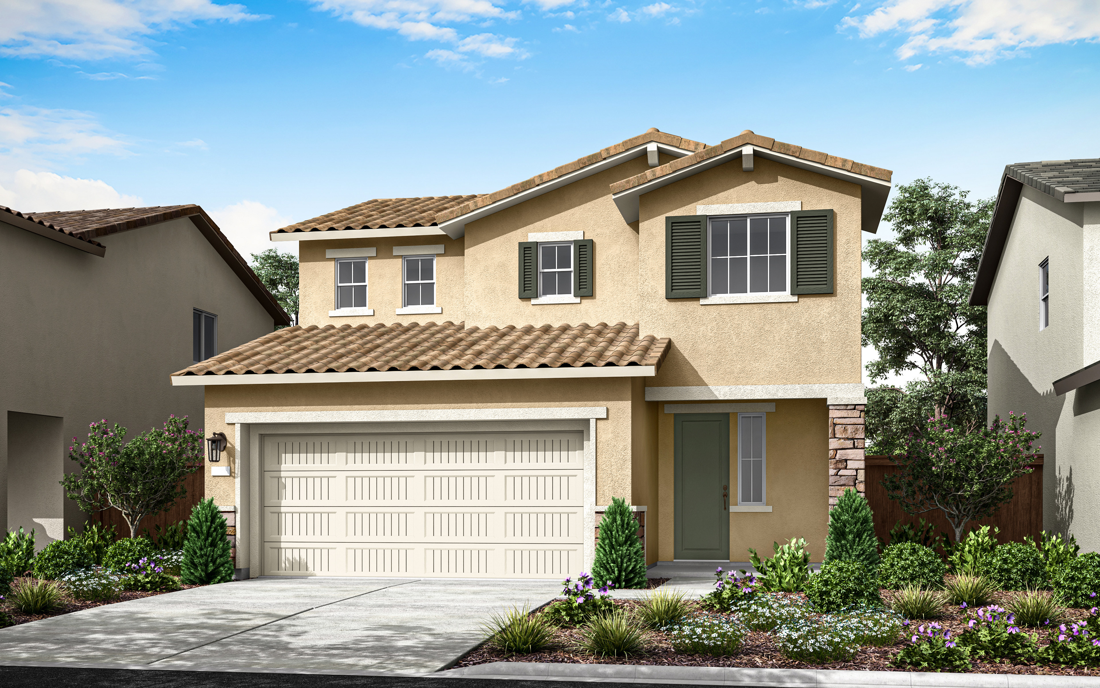 A two-story beige house with a tiled roof, a garage door, and a well-landscaped front yard with shrubs and flowers, set against a blue sky with scattered clouds.